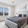 bedroom with bed and large window