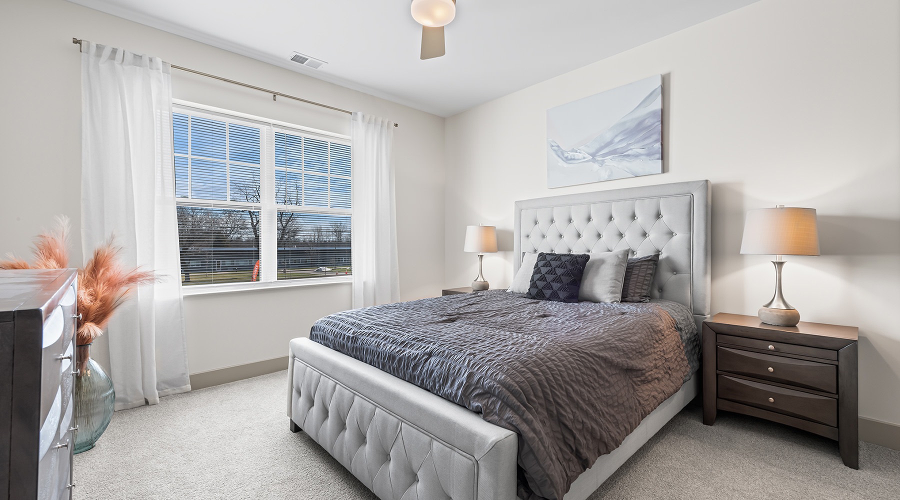 Spacious Bedrooms bedroom with bed and large window